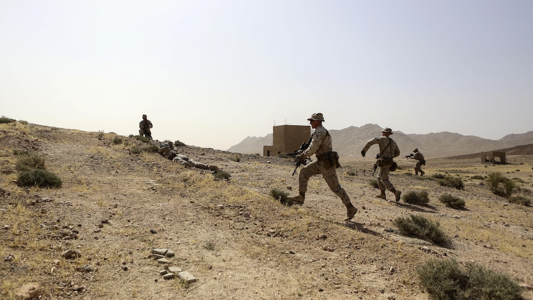 Marines with 1st Battalion, 2nd Marine Regiment, 2nd Marine Division advance on an objective during a squad-level exercise in Al Quweyrah, Jordan, May 14, 2016. During the exercise, platoon commanders relayed combat scenarios to squad leaders, delegating tactical decision-making down to the squad level.