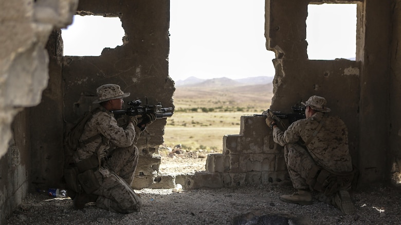 Marines with 1st Battalion, 2nd Marine Regiment, 2nd Marine Division occupy an objective during a squad-level exercise in Al Quweyrah, Jordan, May 14, 2016. During the exercise, platoon commanders relayed combat scenarios to squad leaders, delegating tactical decision-making down to the squad level.