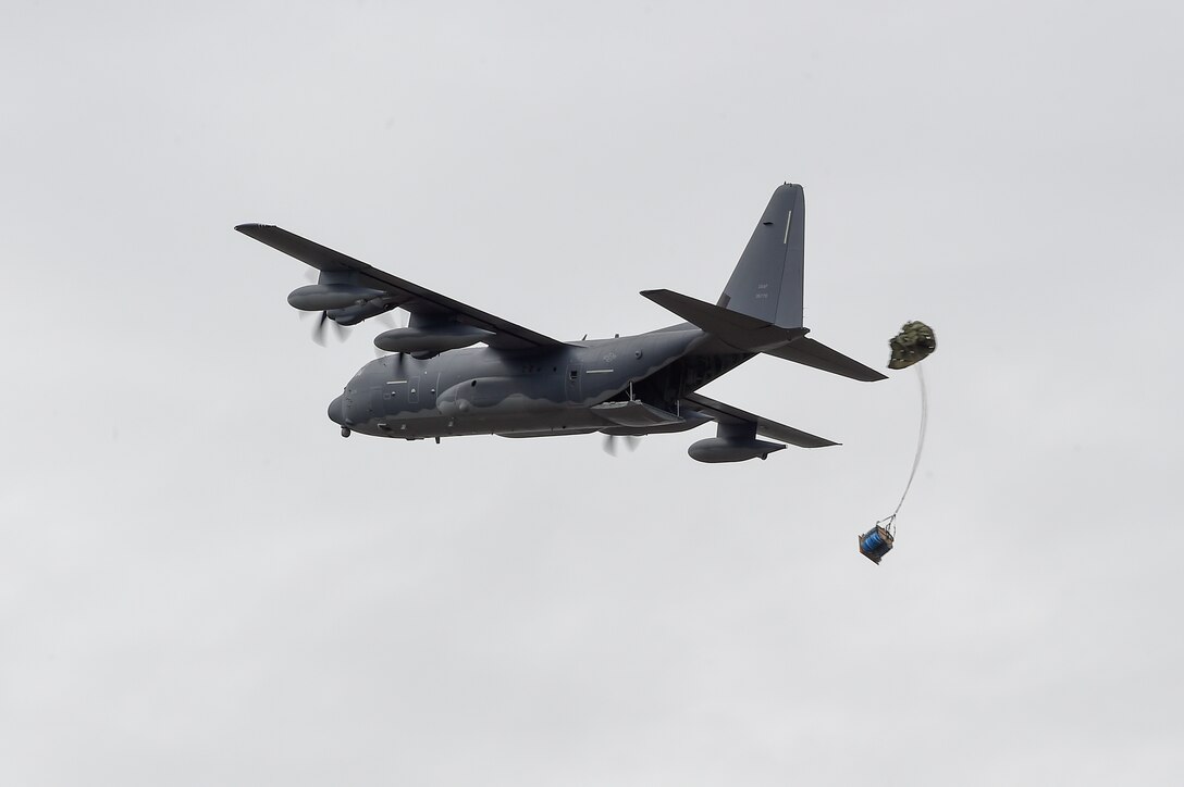 An Air Force MC-130J Commando II delivers a container delivery system over Malemute drop zone during Red Flag Alaska 16-1 at Joint Base Elmendorf-Richardson, May 11, 2016. The pilots and aircraft are assigned to the 1st Special Operations Squadron, deployed from Kadena Air Base, Japan. Air Force photo by Alejandro Pena