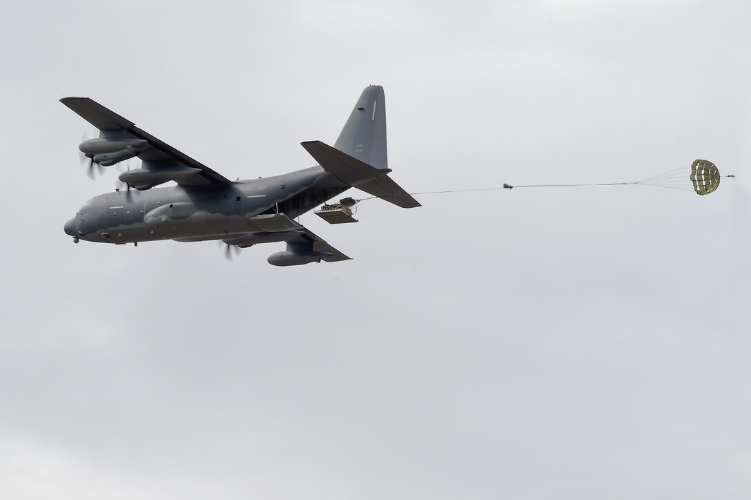 An Air Force MC-130J Commando II drops a heavy pallet over Malemute drop zone during Red Flag Alaska 16-1 at Joint Base Elmendorf-Richardson, May 11, 2016. The pilots and aircraft are assigned to the17th Special Operations Squadron, deployed from Kadena Air Base, Okinawa, Japan. Air Force photo by Alejandro Pena
