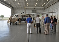 Employers listen to a briefer inside a hangar during the 919th Special Operations Wing’s Employer Appreciation Day at Duke Field, Fla., May 13, 2016.  Each year, the wing’s Citizen Air Commandos nominate their civilian employers to tour the base and learn more about their roles in national defense. (U.S. Air Force photo/Dan Neely)