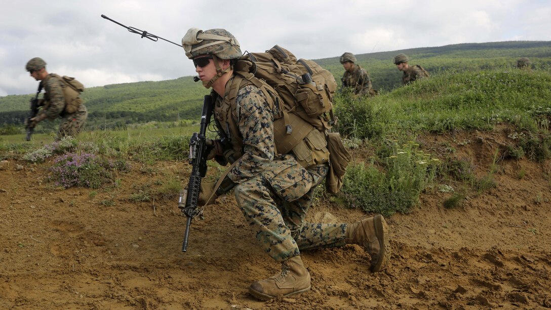 U.S. Marine Corps Cpl. Maxwell A. Fritz, a field radio operator with Bravo Company, Special Purpose Marine Air-Ground Task Force Crisis Response-Africa, prepares to advance for the assault on Military Operations on Urban Terrain Town during Platinum Lion 16-3 at the Novo Selo Training Area, Bulgaria, May 10, 2016. Hundreds of troops from five NATO countries came together to train with mechanized assets and demonstrate the ability to work seamlessly as one force. 