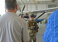 Chief Master Sgt. Ronald McCulley, 919th Security Forces Squadron, briefs visiting employers in front of a C-145A Skytruck during the 919th Special Operations Wing’s Employer Appreciation Day at Duke Field, Fla., May 13, 2016.  Each year, the wing’s Citizen Air Commandos nominate their civilian employers to tour the base and learn more about their roles in national defense. (U.S. Air Force photo/Dan Neely)
