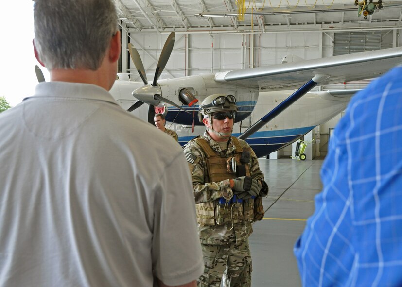 Chief Master Sgt. Ronald McCulley, 919th Security Forces Squadron, briefs visiting employers in front of a C-145A Skytruck during the 919th Special Operations Wing’s Employer Appreciation Day at Duke Field, Fla., May 13, 2016.  Each year, the wing’s Citizen Air Commandos nominate their civilian employers to tour the base and learn more about their roles in national defense. (U.S. Air Force photo/Dan Neely)