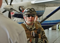 Chief Master Sgt. Ronald McCulley, 919th Security Forces Squadron, responds to a visiting employer’s questions in front of a C-145A Skytruck during the 919th Special Operations Wing’s Employer Appreciation Day at Duke Field, Fla., May 13, 2016. Each year, the wing’s Citizen Air Commandos nominate their civilian employers to tour the base and learn more about their roles in national defense. (U.S. Air Force photo/Dan Neely)