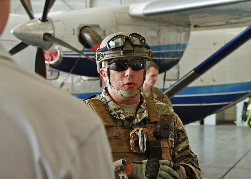 Chief Master Sgt. Ronald McCulley, 919th Security Forces Squadron, responds to a visiting employer’s questions in front of a C-145A Skytruck during the 919th Special Operations Wing’s Employer Appreciation Day at Duke Field, Fla., May 13, 2016. Each year, the wing’s Citizen Air Commandos nominate their civilian employers to tour the base and learn more about their roles in national defense. (U.S. Air Force photo/Dan Neely)
