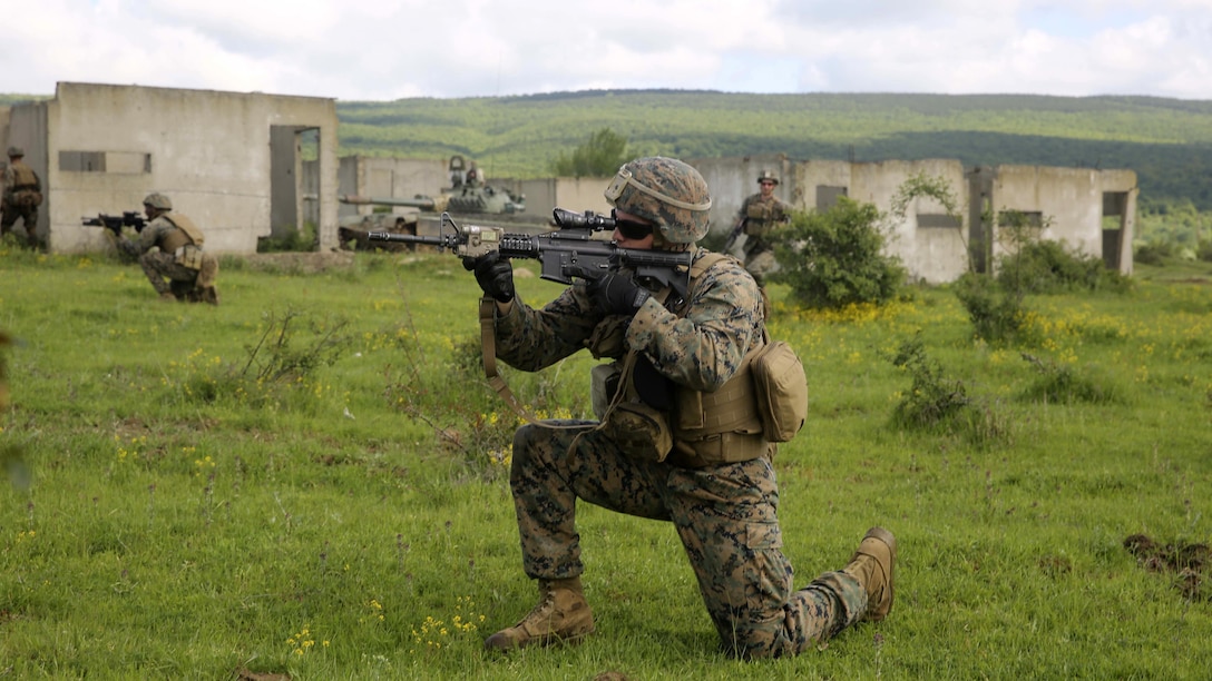 U.S. Marine Corps Lance Cpl. Jacob C. Gross, a rifleman with Bravo Company, Special Purpose Marine Air-Ground Task Force Crisis Response-Africa, search and assesses the area before advancing for the assault on Military Operations on Urban Terrain Town during Platinum Lion 16-3 at the Novo Selo Training Area, Bulgaria, May 10, 2016. Hundreds of troops from five NATO countries came together to train with mechanized assets and demonstrate the ability to work seamlessly as one force. 