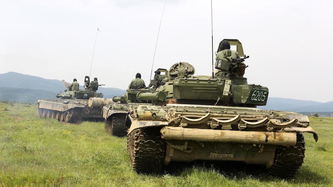 Bulgarian T-72 tanks prepare to line up and fire downrange for the tank live-fire exercise during Platinum Lion 16-3 at the Novo Selo Training Area, Bulgaria, May 12, 2016. During Platinum Lion 16-3, Allies from the United States and four partner nations will conduct platoon-level mechanized tactics in order to develop proficiency in fire and maneuver. 