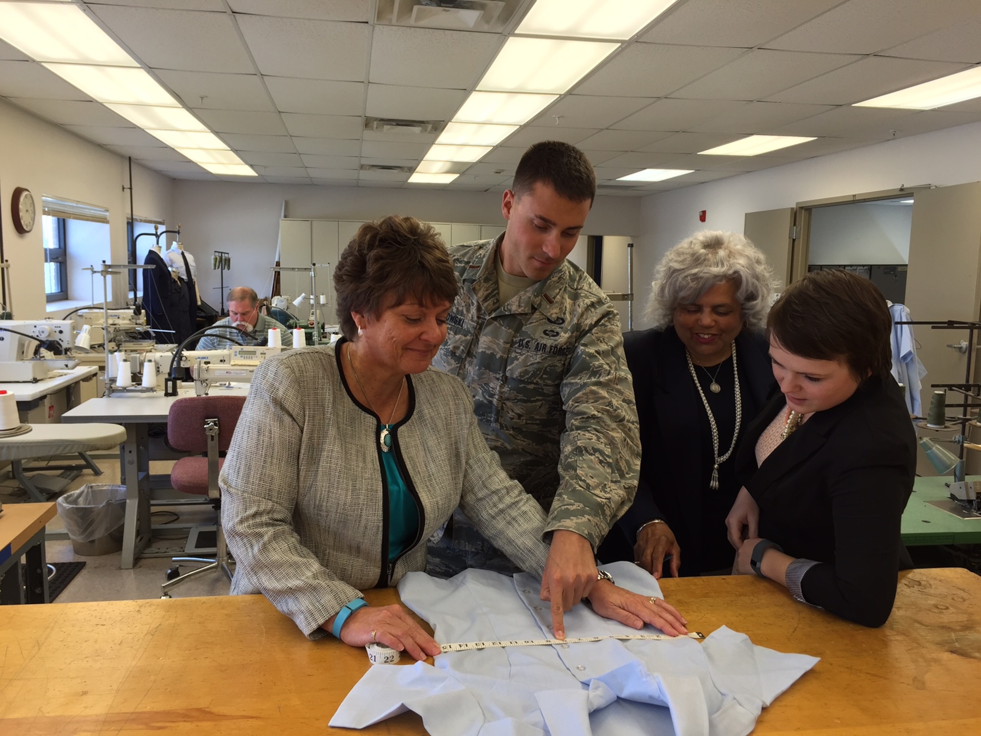 Reviewing a prototype women’s service dress uniform overblouse, left to right, at the Air Force Uniform Office, Air Force Life Cycle Management Center on Wright-Patterson Air Force Base, Ohio, are Tracy Roan, the clothing designer; 2nd Lt. Adam Samlowski, the program manager; Yvonne Wilson, the section chief, clothing and textiles; and Maggie Tanner, the pattern designer. (Skywrighter photo/Amy Rollins)