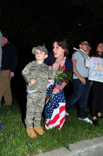 Mother and son are one of many Reserve family and friends waiting May 4, for the arrival of their loved one from a recent deployment to Southwest Asia. The Freedom Wing KC-10 aircrew and maintainers were deployed for more than two  months in support of Operation Inherent Resolve.