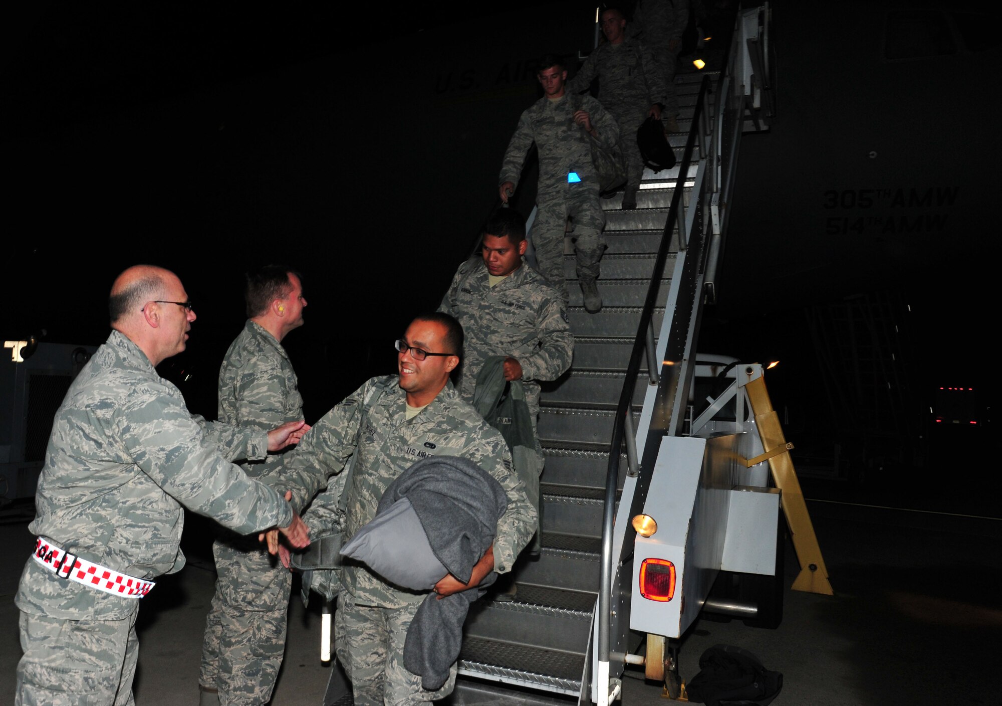 KC-10 Extender maintainers and aircrew returning from deployment May 4, are greeted by their 514th Air Mobility Wing leadership, family and friends. 