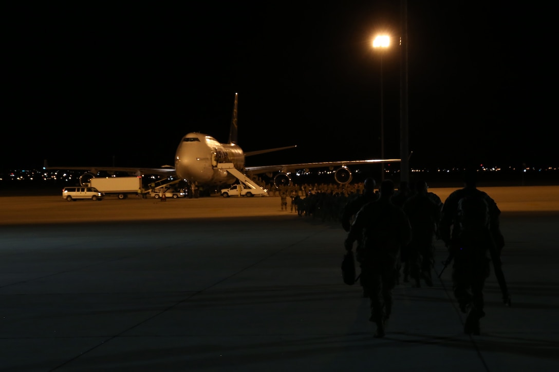 Soldiers assigned to 863rd Eng. Bn., 282nd Eng. Co., 945th Eng. Det., 313th SD Eng. Det., all Reserve units, and the 204th Eng. Det., Ohio Army National Guard, make their way to the aircraft at the Silas L. Copeland Arrival/Departure Airfield Control Group here May 2.