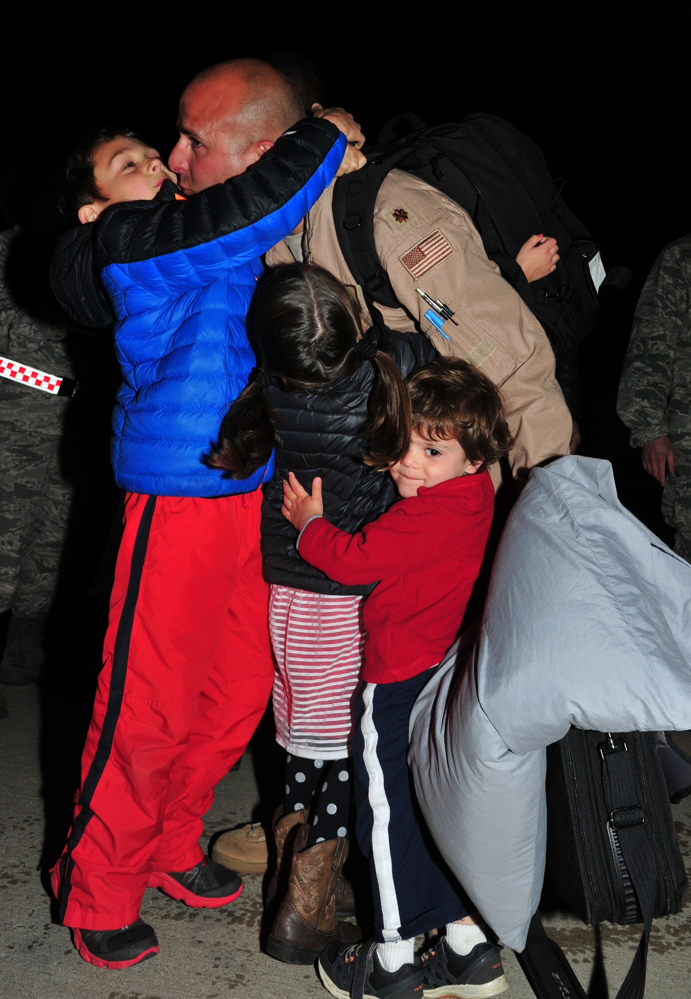 Maj. Brad Tobias, a Reserve KC-10 Extender pilot with the 78th Air Refueling Squadron here, is greeted with love after he returns May 4, from a two-month deployment to Southwest Asia. The Freedom Wing Airman was deployed in support of Operation Inherent Resolve. 