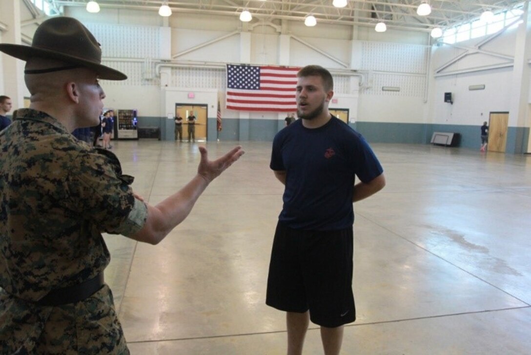 A U.S. Marine Corps drill instructor corrects a poolee for not moving with speed and intensity during Recruiting Station Charleston’s Statewide Function April 16, 2016. The bi-annual event brought poolees from across West Virginia, Virginia, Tennessee and Kentucky together to participate in an Initial Strength Test and compete in a field meet. (U.S. Marine Corps photo by Sgt. Caitlin Brink/released)