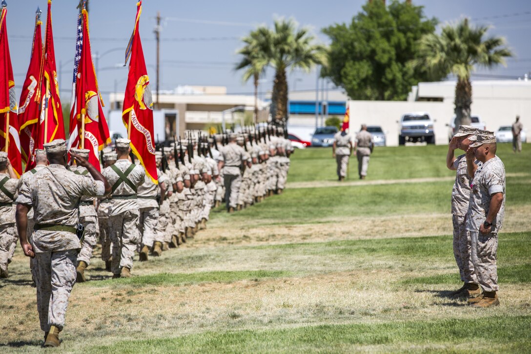 Maj. Gen. Lewis A. Craparotta, Combat Center Commanding General, Sgt. Maj. Karl Villalino, former Combat Center Sergeant Major, and Sgt. Maj. Michael J. Hendges, Combat Center Sergeant Major, salute during the pass in review as part of a relief and appointment ceremony at Lance Cpl. Torrey L. Gray Field May 10, 2016.  Villalino relinquished his post as Combat Center Sergeant Major to Sgt. Maj. Michael J. Hendges and retired after 30 years of honorable service. (Official Marine Corps photo by Lance Cpl. Levi Schultz/Released)