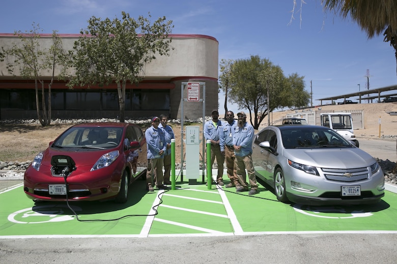Public Works Division personnel finish installing one of the three electric vehicle charging stations aboard the Combat Center. (Official Marine Corps photo by Lance Cpl. Dave Flores)