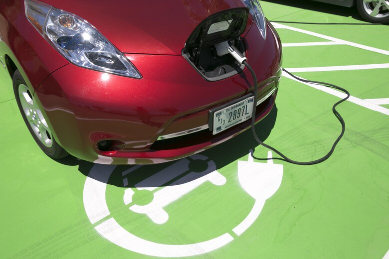 Navy Lt. Sam Yu, assistant public works officer, Public Works Division, charges a government electric vehicle at one of the charging stations that was recently installed, as part of Executive Order 13693, Planning for Federal Sustainability in the Next Decade, aboard the Combat Center. The charging stations were tested May 3, 2016 as part of the Combat Center’s initiative to further the installation’s conservation and sustainability efforts. (Official Marine Corps photo by Lance Cpl. Dave Flores)