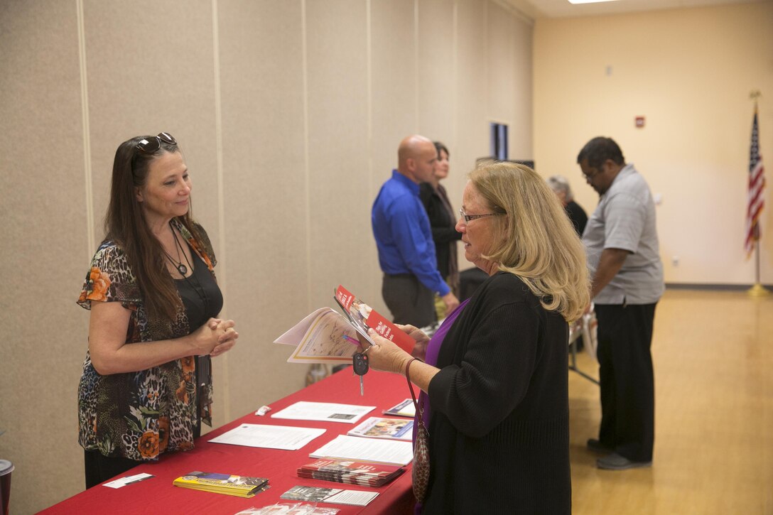 Virginia Sulick, staffing specialist, Combat Center Human Resources Office, answers questions for Linda Bunnell, supported employment manager, Desert Arc, during the ‘How to do Business with the Base’ event at Copper Mountain College May 5, 2016. (Official Marine Corps photo by Cpl. Thomas Mudd/Released)