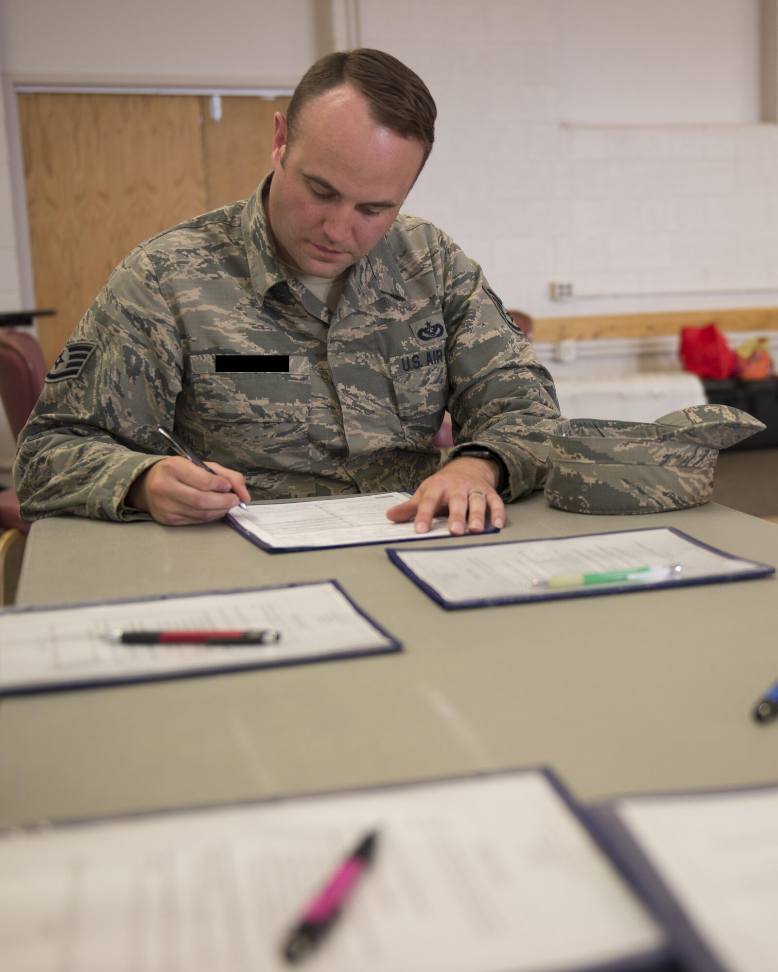 Staff Sgt. Scott, a 49th Materiel Maintenance Squadron heating, ventilation and air conditioning craftsman, fills out a sign-up sheet to donate blood here May 17. Participants register themselves then answer some questions about their health and travel history during a private interview. Donors make their donation and have a snack before they leave. Donating blood is a simple process that can save lives in an emergency. (Last names are being withheld due to operational requirements. U.S. Air Force photo by Airman 1st Class Randahl J. Jenson)