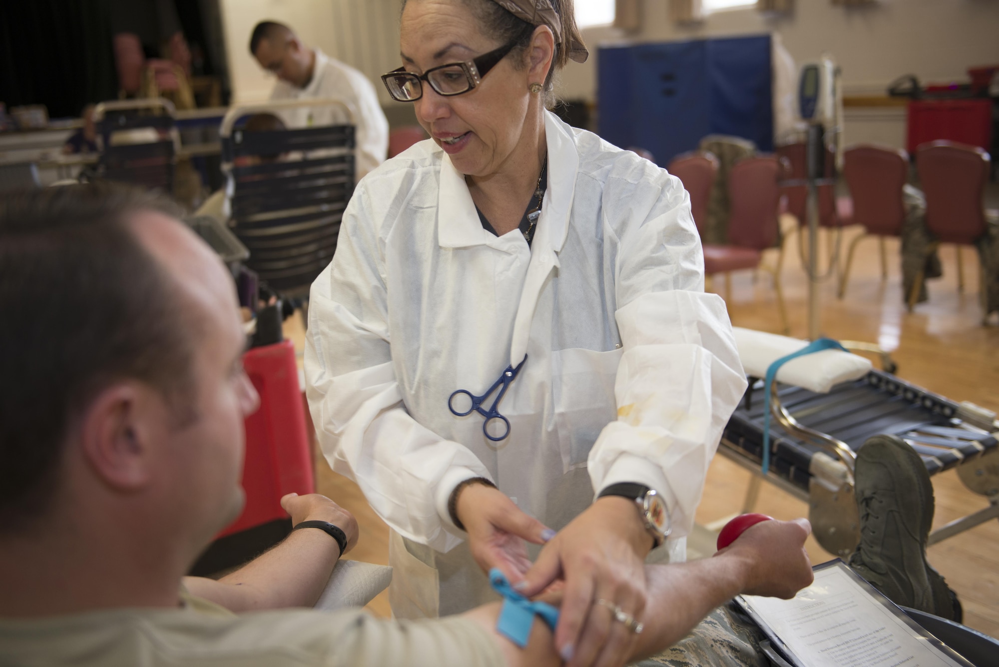Sarah, a medical technician from Fort Bliss, Texas prepares Staff Sgt. Scott, a 49th Materiel Maintenance Squadron heating, ventilation and air conditioning craftsman to have his blood drawn here May 17. Medical technicians help ensure the process of drawing blood is efficient and safe for the donor. Donating blood is a simple process that can save lives in an emergency. (Last names are being withheld due to operational requirements. U.S. Air Force photo by Airman 1st Class Randahl J. Jenson)