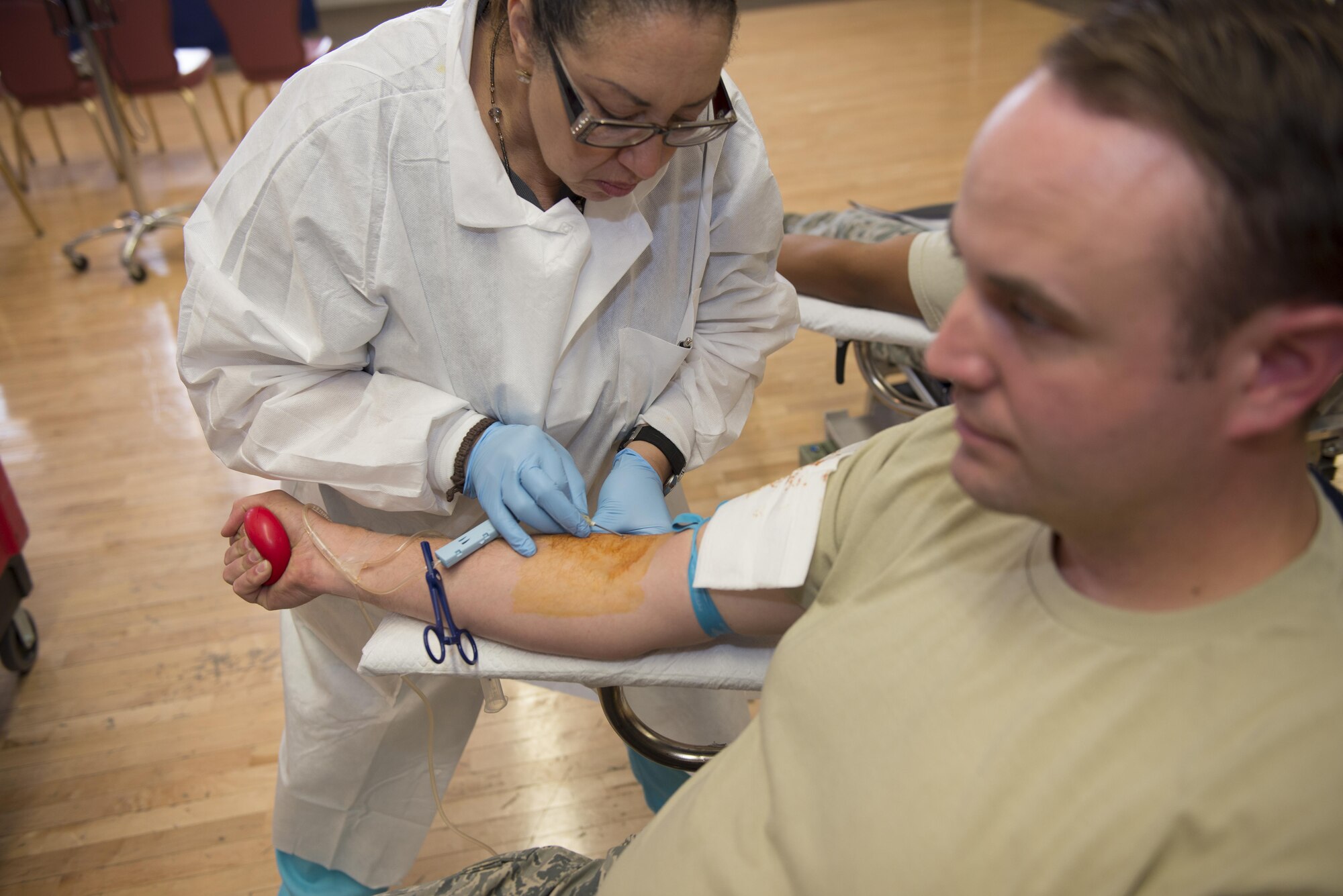 Sarah, a medical technician from Fort Bliss, Texas draws blood from Staff Sgt. Scott, a 49th Materiel Maintenance Squadron heating, ventilation and air conditioning craftsman here May 17. Medical technicians help ensure the process of drawing blood is efficient and safe for the donor. Donating blood is a simple process that can save lives in an emergency. (Last names are being withheld due to operational requirements. U.S. Air Force photo by Airman 1st Class Randahl J. Jenson)