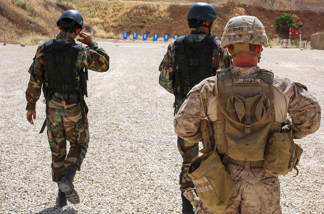 U.S. Marine Corps Cpl. Tristan P. Diaz, a Marine rifleman with Golf Co., 2nd Battalion, 7th Marine Regiment, attached to the Special Purpose Marine Air Ground Task Force Crisis Response Central Command 16.2 and members of the Jordanian Armed Forces participate in a live fire range during Exercise Eager Lion 16 at The King Abdullah II Special Operations Training Center, Kingdom of Jordan on May 17, 2016. Eager Lion 16 is a US military bi-lateral exercise with the Hashemite Kingdom of Jordan designed to strengthen relationships and interoperability between partner nations. (U.S. Marine Corps photo by Lance Cpl Alejandro Dominguez/Released)