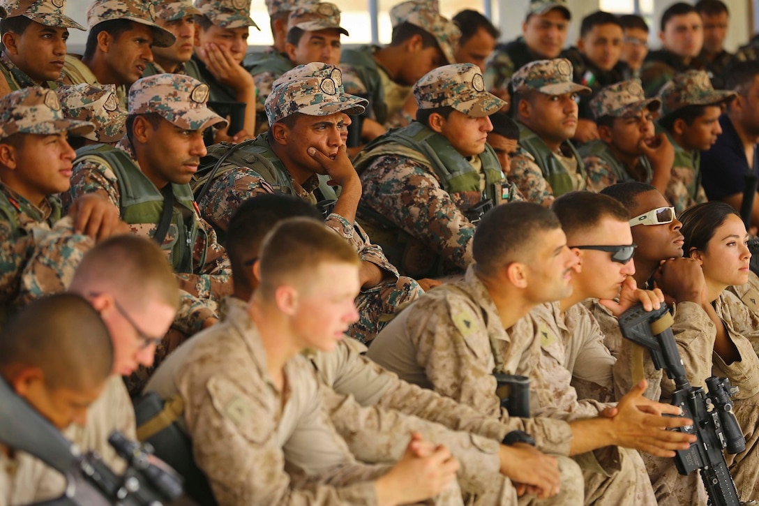 Members of the Jordanian Armed Forces and U.S. Marines with 2nd Battalion, 7th Marine Regiment, Special Purpose Marine Air Ground Task Force Crisis Response Central Command 16.2, attend a safety brief prior to a live fire range during Exercise Eager Lion 16 at King Abdullah II Special Operations Training Center, Kingdom of Jordan on May 17, 2016. Eager Lion 16 is a US military bi-lateral exercise with the Hashemite Kingdom of Jordan designed to strengthen relationships and interoperability between partner nations. (U.S. Marine Corps photo by Cpl. Lauren Falk 5th MEB COMCAM/Released)