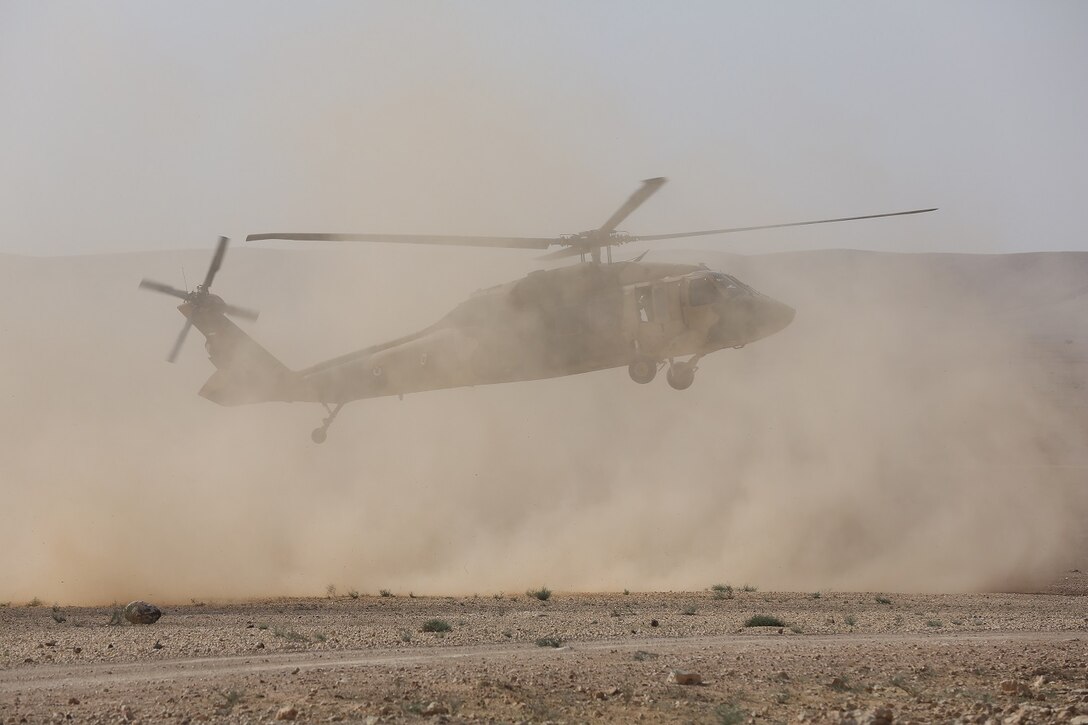 Jordanian Armed Forces UH-60 Blackhawks with A-Squadron, practice infils and exfils prior to a live fire event during Exercise Eager Lion 16 at Armor Range, Quick Reaction Force, Kingdom of Jordan on May 16, 2016. Eager Lion 16 is a bi-lateral exercise in the Hashemite Kingdom of Jordan between the Jordanian Armed Forces and the U.S. Military designed to strengthen relationships and interoperability between partner nations. (U.S. Marine Corps photo by Lance Cpl. Alejandro Dominguez/Released)