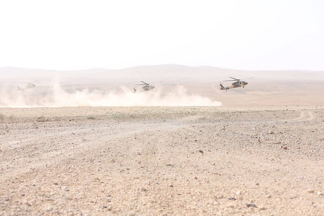 Jordanian Armed Forces UH-60 Blackhawks with A-Squadron, practice infils and exfils prior to a live fire event during Exercise Eager Lion 16 at Armor Range, Quick Reaction Force, Kingdom of Jordan on May 16, 2016. Eager Lion 16 is a bi-lateral exercise in the Hashemite Kingdom of Jordan between the Jordanian Armed Forces and the U.S. Military designed to strengthen relationships and interoperability between partner nations. (U.S. Marine Corps photo by Lance Cpl. Alejandro Dominguez/Released)