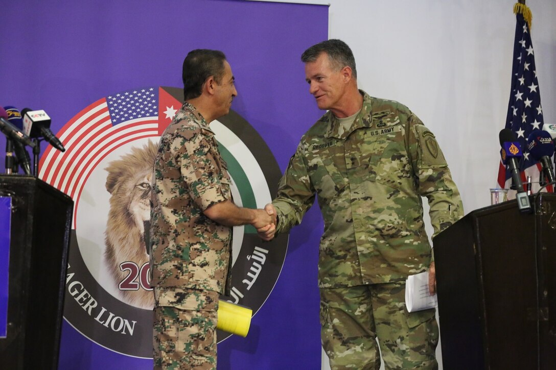 U.S. Army Maj. Gen. Ralph H. Groover III, U.S. Central Command director of Exercises and Training Directorate and Brig. Gen. Fahad Al-Damin, director of Joint Training for the Jordanian Armed Forces shake hands at the conclusion of a press conference during Exercise Eager Lion 16 at Jordanian Special Operations Command military headquarters in Amman, Kingdom of Jordan, May 15 Eager Lion 16 is a US military bi-lateral exercise with the Hashemite Kingdom of Jordan designed to strengthen relationships and interoperability between partner nations. (U.S. Marine Corps photo by. Lance Cpl Alejandro Dominguez/Released)