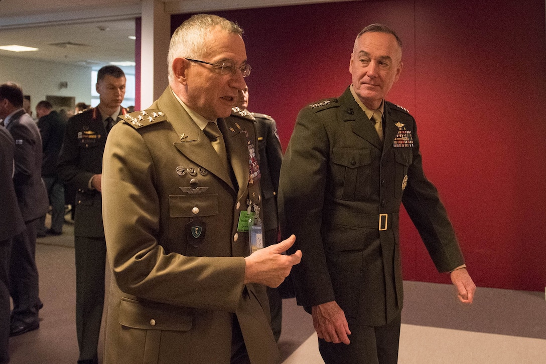 Marine Corps Gen. Joe Dunford, right, chairman of the Joint Chiefs of Staff, talks with Italian Chief of Defense Gen. Claudio Graziano between sessions at the NATO Military Committee/Chiefs of Defense Session in Brussels, May 18, 2016. DoD photo by D. Myles Cullen