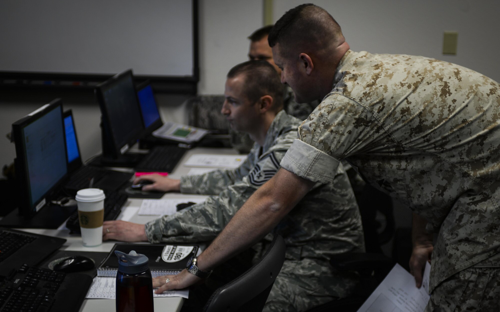 Master Sgt. Thomas Moore prepares for a presentation with fellow classmates during his final week of the Advanced Maintenance and Munitions Operations School’s Advanced Maintenance Superintendent Course at Nellis Air Force Base, Nev., May 16, 2016. The AMSC takes senior NCOs and pushes them past what they would normally have to handle while at home station by forcing them to also manage maintenance in a combat environment. (U.S. Air Force photo by Airman 1st Class Kevin Tanenbaum)