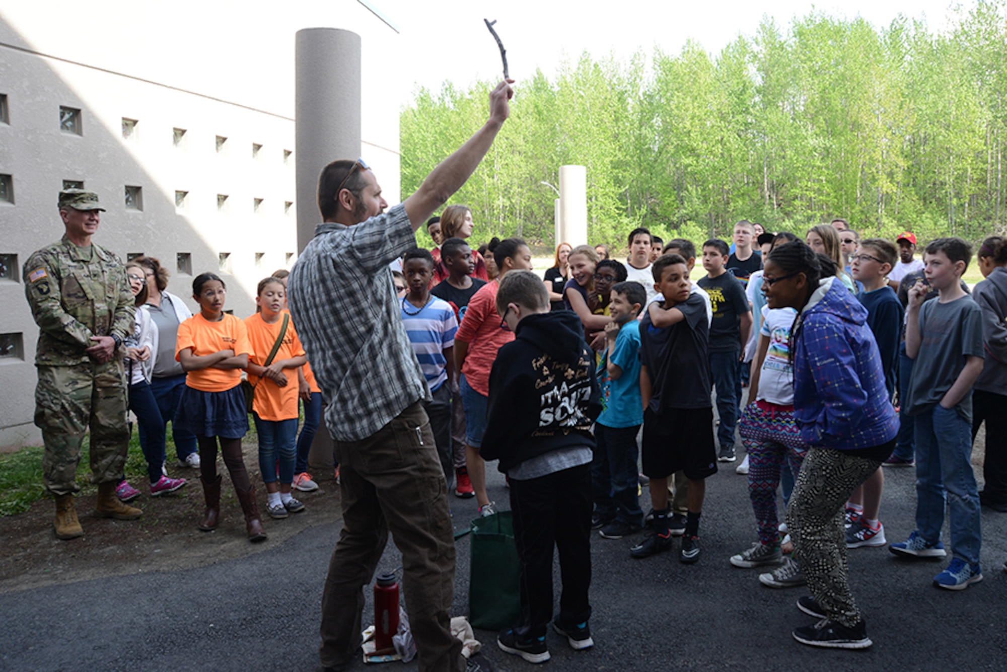 Steve Nickle, Alaska State Community Forester, teaches members of the Torch and Keystone clubs the importance of trees at the Two Rivers Youth Center for National Arbor Day at Joint Base Elmendorf-Richardson, May 16, 2016. Army Col. Timothy Wulff, 673d Air Base Wing vice commander, also gave remarks and read the 2015 proclamation for National Arbor Day before the children planted two white spruce trees. (U.S. Air Force photo by Airman 1st Class Christopher R. Morales)