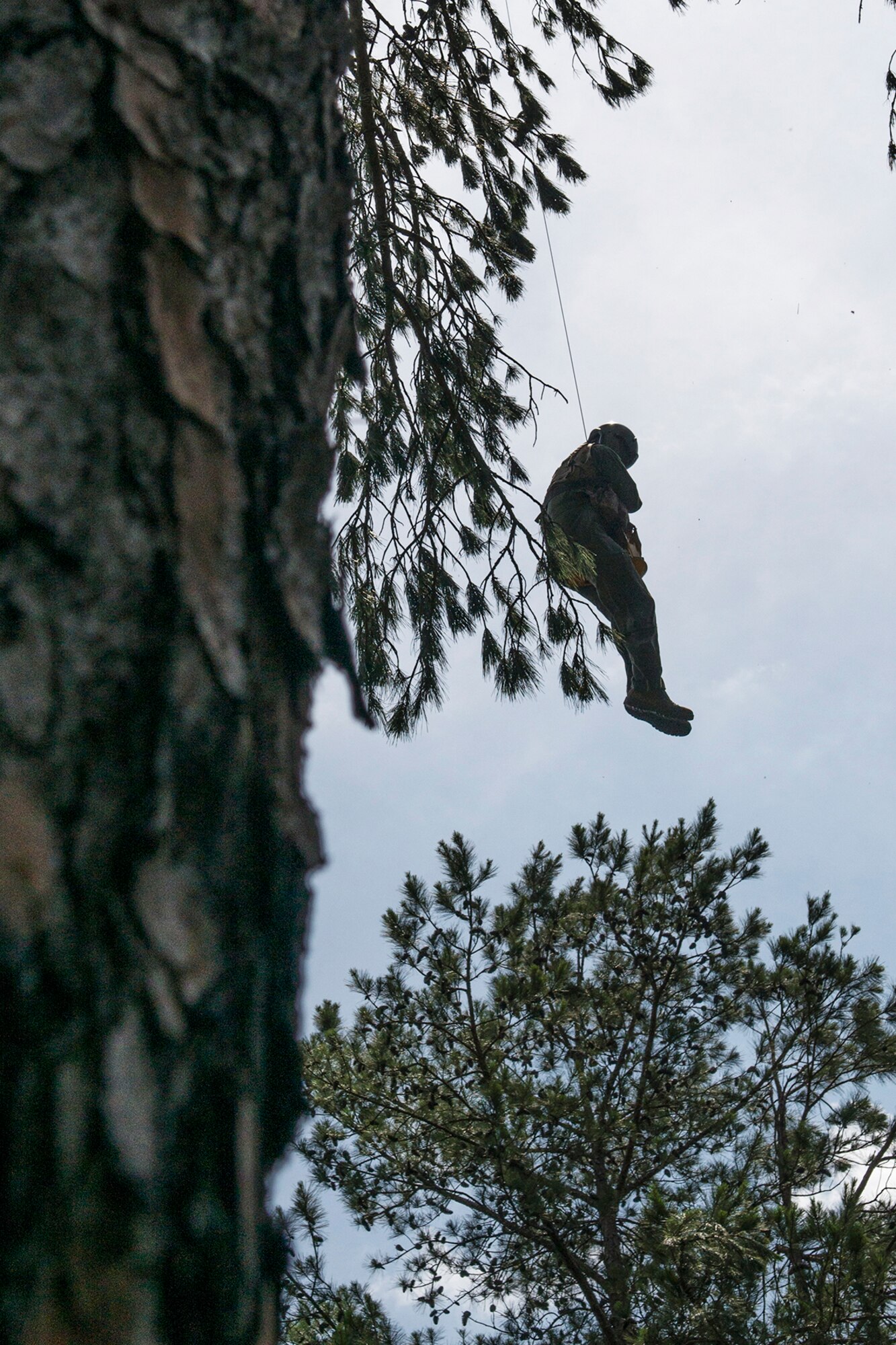 U.S. Air Force Lt. Col. Christopher Anderson, the commander of the 307th Operations Support Squadron, is hoisted to safety during SERE training on May 14, 2016, Claiborne Gunnery and Bombing Range, La. SERE, which stands for Survival, Evasion, Resistance and Escape, is required training for all aircrew members and provides the knowledge and tools necessary to survive on their own in any environment and under any condition should they have to abandon their aircraft. (U.S. Air Force photo by Master Sgt. Greg Steele/Released)