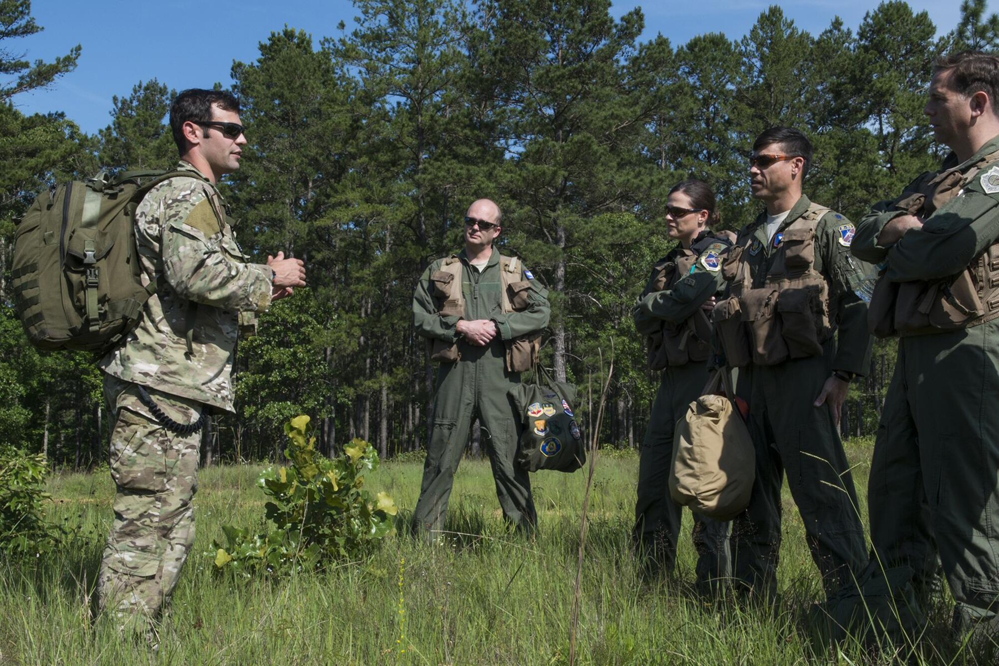 U.S. Air Force Staff Sgt. Matthew Mete, 2nd Operations Support Squadron SERE instructor, briefs a group of 93rd Bomb Squadron aircrew members prior to the start of their training on May 14, 2016, Claiborne Gunnery and Bombing Range, La. SERE, which stands for Survival, Evasion, Resistance and Escape, is required training for all aircrew members and provides the knowledge and tools necessary to survive on their own in any environment and under any condition should they have to abandon their aircraft. (U.S. Air Force photo by Master Sgt. Greg Steele/Released)