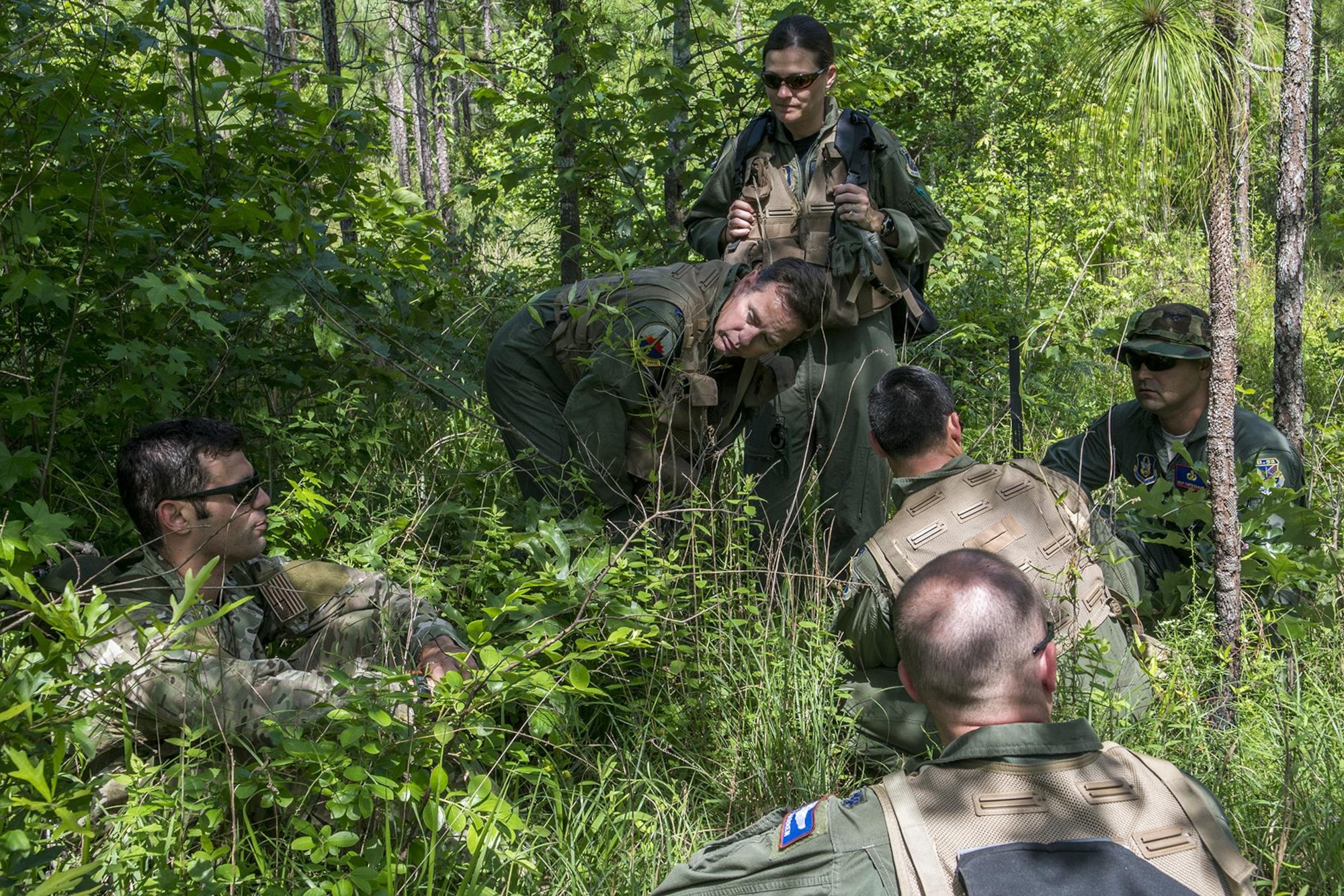U.S. Air Force Staff Sgt. Matthew Mete, 2nd Operations Support Squadron SERE instructor, talks about survival and evasion techniques to a group of 93rd Bomb Squadron aircrew members during training on May 14, 2016, Claiborne Gunnery and Bombing Range, La. SERE, which stands for Survival, Evasion, Resistance and Escape, is required training for all aircrew members and provides the knowledge and tools necessary to survive on their own in any environment and under any condition should they have to abandon their aircraft. (U.S. Air Force photo by Master Sgt. Greg Steele/Released)