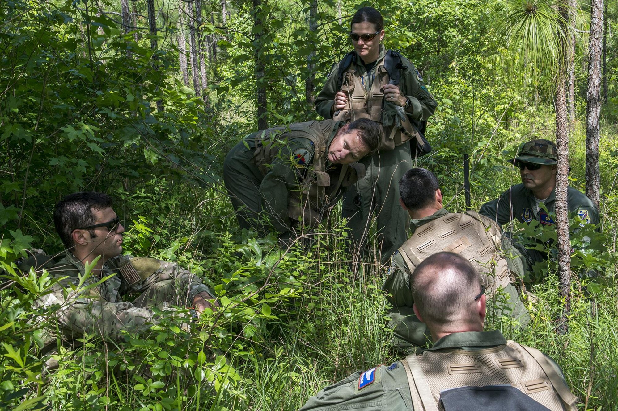 U.S. Air Force Staff Sgt. Matthew Mete, 2nd Operations Support Squadron SERE instructor, talks about survival and evasion techniques to a group of 93rd Bomb Squadron aircrew members during training on May 14, 2016, Claiborne Gunnery and Bombing Range, La. SERE, which stands for Survival, Evasion, Resistance and Escape, is required training for all aircrew members and provides the knowledge and tools necessary to survive on their own in any environment and under any condition should they have to abandon their aircraft. (U.S. Air Force photo by Master Sgt. Greg Steele/Released)