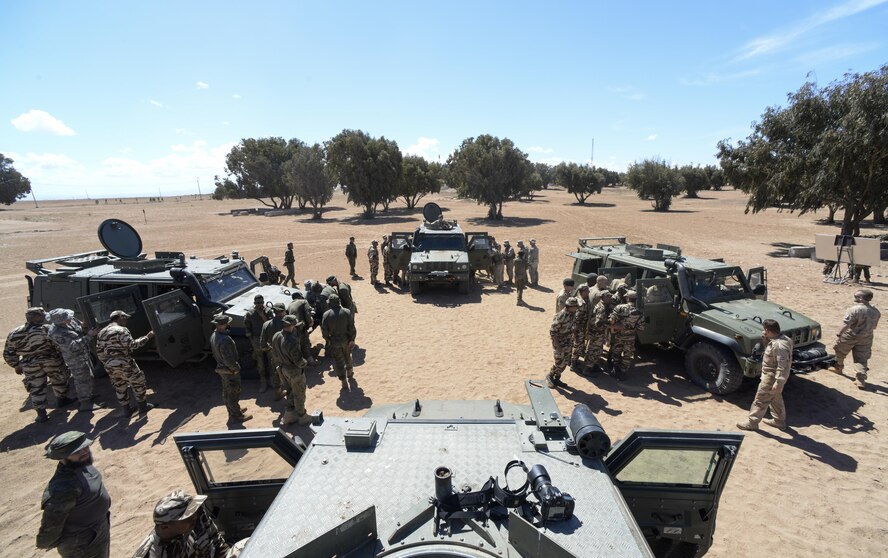 Participants of AFRICAN LION 16 examine Humvees from different countries at Tifnit, Morocco, April 20, 2016.  The training began with vehicle familiarization and concluded with an exercise in convoy operations. (U.S. Air Force photo by Senior Airman Krystal Ardrey)