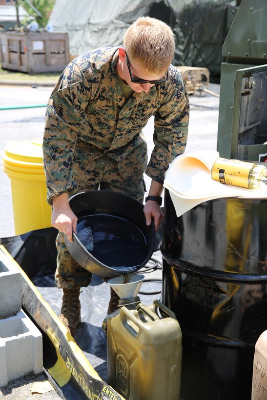 Lance Cpl. Arron Kristof empties oil from a generator into a container during Marine Expeditionary Force Exercise 2016, at Marine Corps Air Station Cherry Point, N.C., May 11, 2016. MEFEX 16 is a command and control exercise conducted in a deployed environment designed to synchronize and bring to bear the full spectrum of II MEF’s C2 capabilities in support of a Marine Air-Ground Task Force. Kristof is a utilities mechanic with Marine Wing Support Squadron 271. (U.S. Marine Corps photo by Lance Cpl. Mackenzie Gibson/Released)
