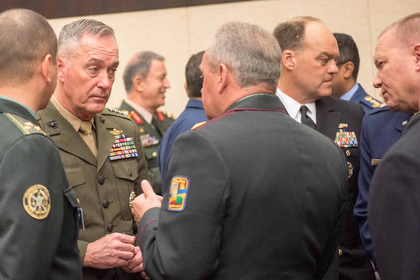 Marine Corps Gen. Joe Dunford, chairman of the Joint Chiefs of Staff, talks with military leaders attending the NATO Military Committee/Chiefs of Defense Session in Brussels, May 18, 2016. DoD photo by D. Myles Cullen