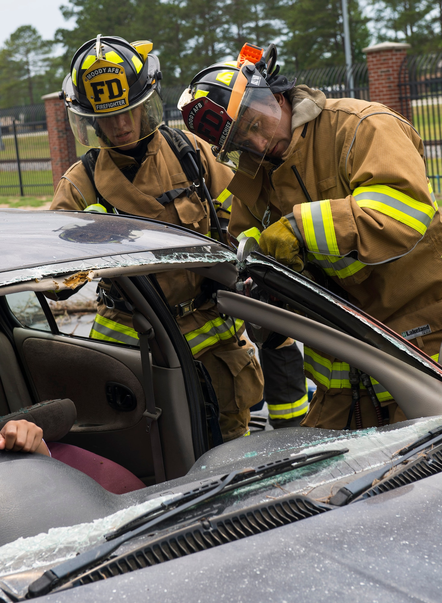 U.S. Air Force Staff Sgt. John Reinoehl, 23d Civil Engineer Squadron fire department crew chief, simulates using a vehicle extrication cutter to remove an injured car accident victim during a hurricane exercise, May 17, 2016, at Moody Air Force Base, Ga. Due to the driver’s injuries, first responders had to remove the vehicle’s roof and windshields to rescue her without causing further harm.  (U.S. Air Force photo by Airman 1st Class Greg Nash/Released)