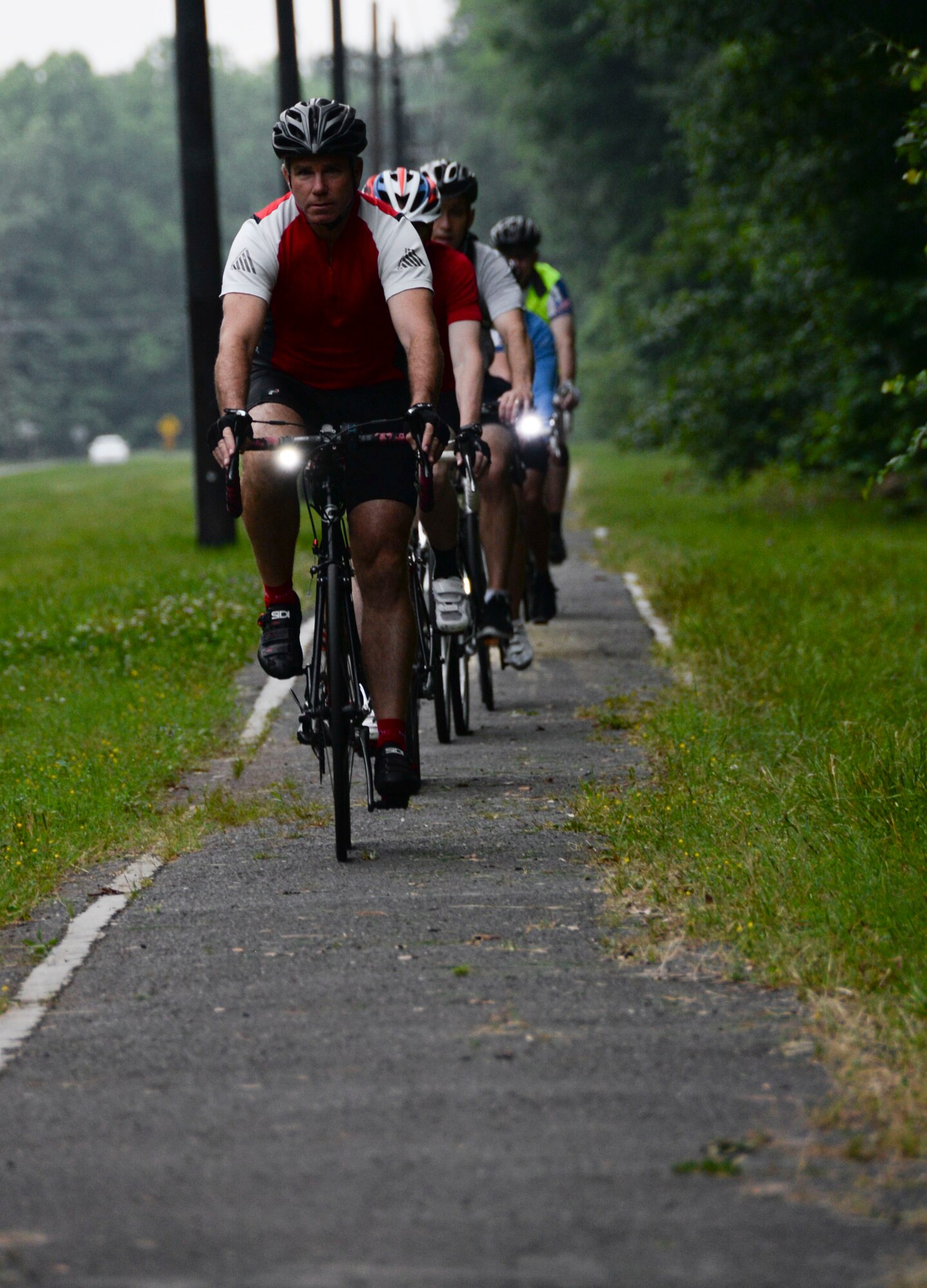 Douglas Skelton, 608th Strategic Operations Squadron strategic mission specialist, leads a group of cyclists during a National Bike to Work Week bike ride at Barksdale Air Force Base, La., May 17, 2016. The ride, which was hosted by the Barksdale Cycling Club was completed after cyclists rode for nine-miles from east side housing to main base. (U.S. Air Force photo/Senior Airman Amanda Morris)