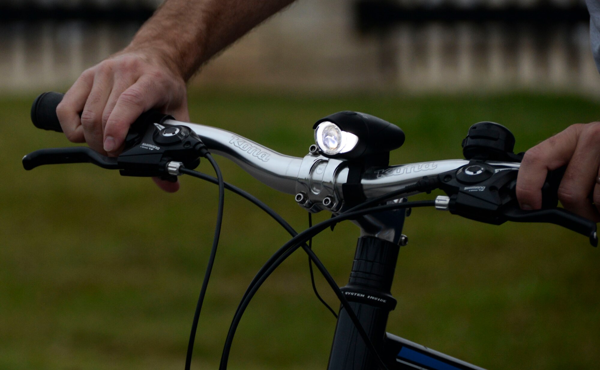 A cyclist checks the light accessory on his bicycle before participating in a bike ride during National Bike to Work Week at Barksdale Air Force Base, La., May 17, 2016. Members of the Barksdale Cycling Club welcomed all cyclists in an effort to encourage more riding on base. Some benefits of cycling include increased physical fitness, lower stress levels, lower transportation costs, it’s environmentally friendly and an opportunity to enjoy the company of friends while appreciating the natural resources Barkdale has to offer. (U.S. Air Force photo/Senior Airman Amanda Morris)
