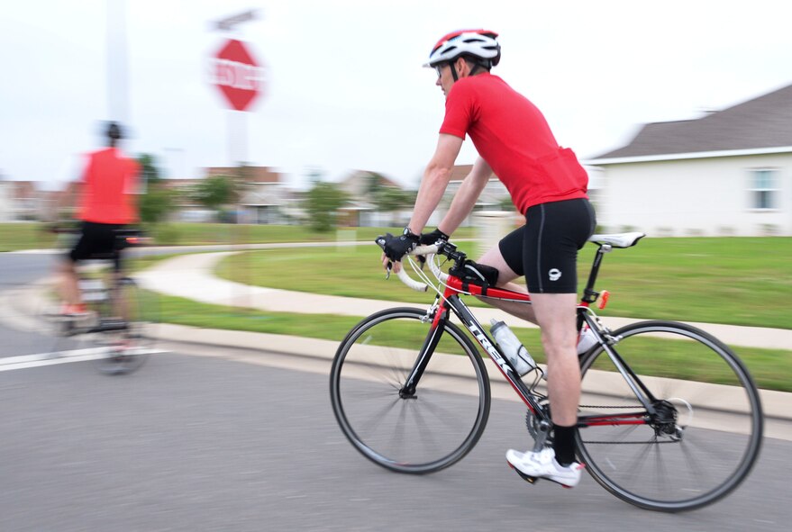 Tech. Sgt. Jason Degering, 2nd Communications Squadron quality assurance NCO in charge, rides his bike to the starting line before participating in a National Bike to Work Week bike ride at Barksdale Air Force Base, La., May 17, 2016. Bike-riding enthusiasts met up at the base’s east side housing and some rode more than 10 miles to their workspaces. (U.S. Air Force photo/Senior Airman Amanda Morris)