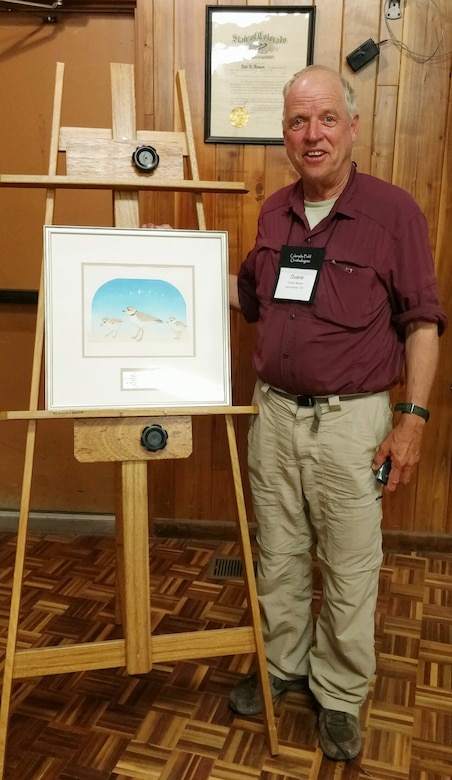 Colorado Field Ornithologists presented 
Duane Nelson, contractor with the Albuquerque District, with a lifetime award for his work with endangered/threatened species at the reservoir, May 7, 2016. Nelson was presented an original painting of a piping plover and two chicks.
