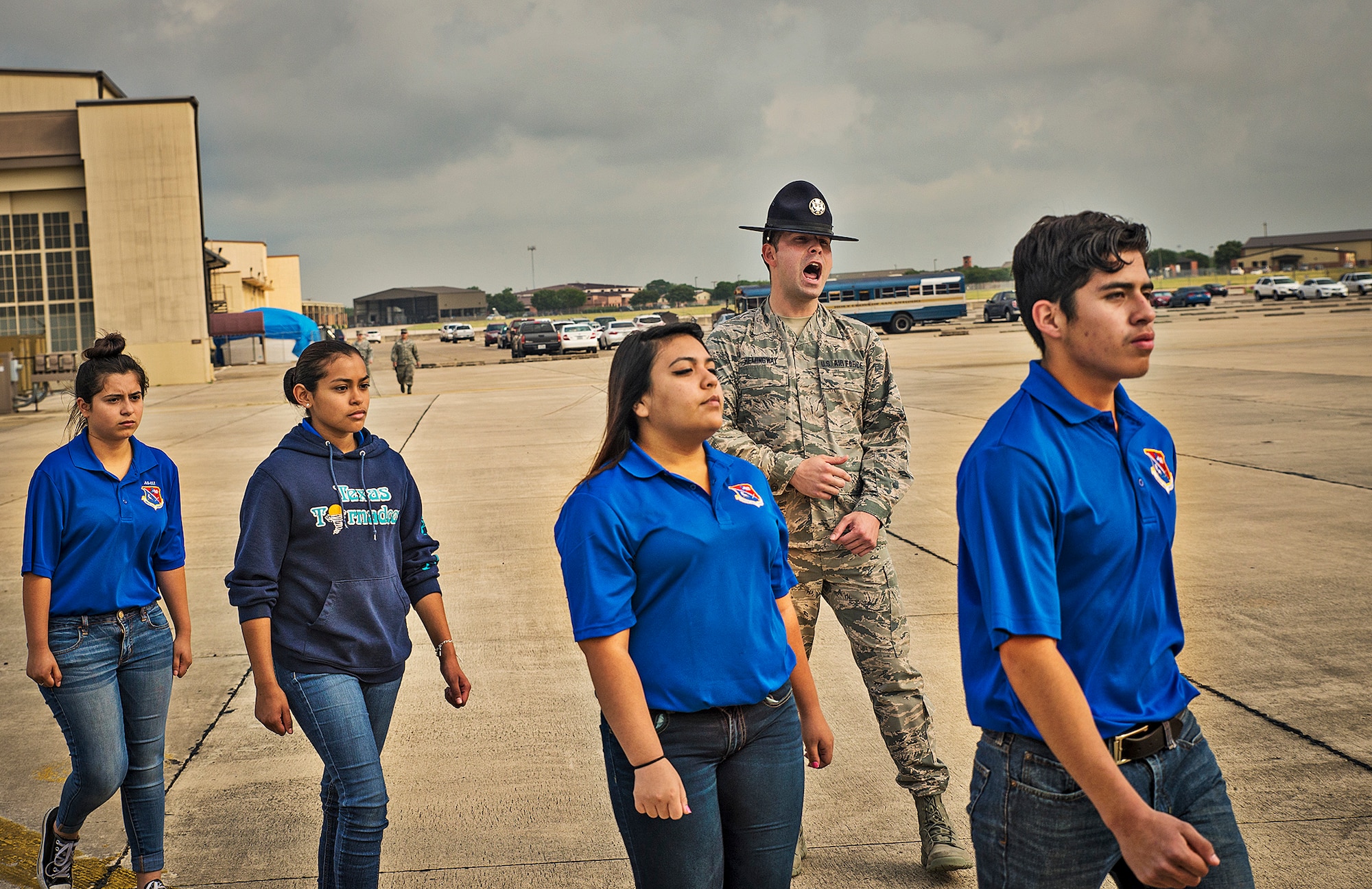 Tech. Sgt. Robert Hemingway, a 433rd Training Squadron military training instructor, yells out commands to Junior ROTC students from John Jay High School May 12, 2016 at Joint Base San Antonio-Lackland, Texas. The students toured the survival, engine, and structural engineering shops at the 433rd Airlift Wing and also saw a Military Working Dog demonstration at the 341st Training Squadron. (U.S. Air Force photo by Benjamin Faske) (released)