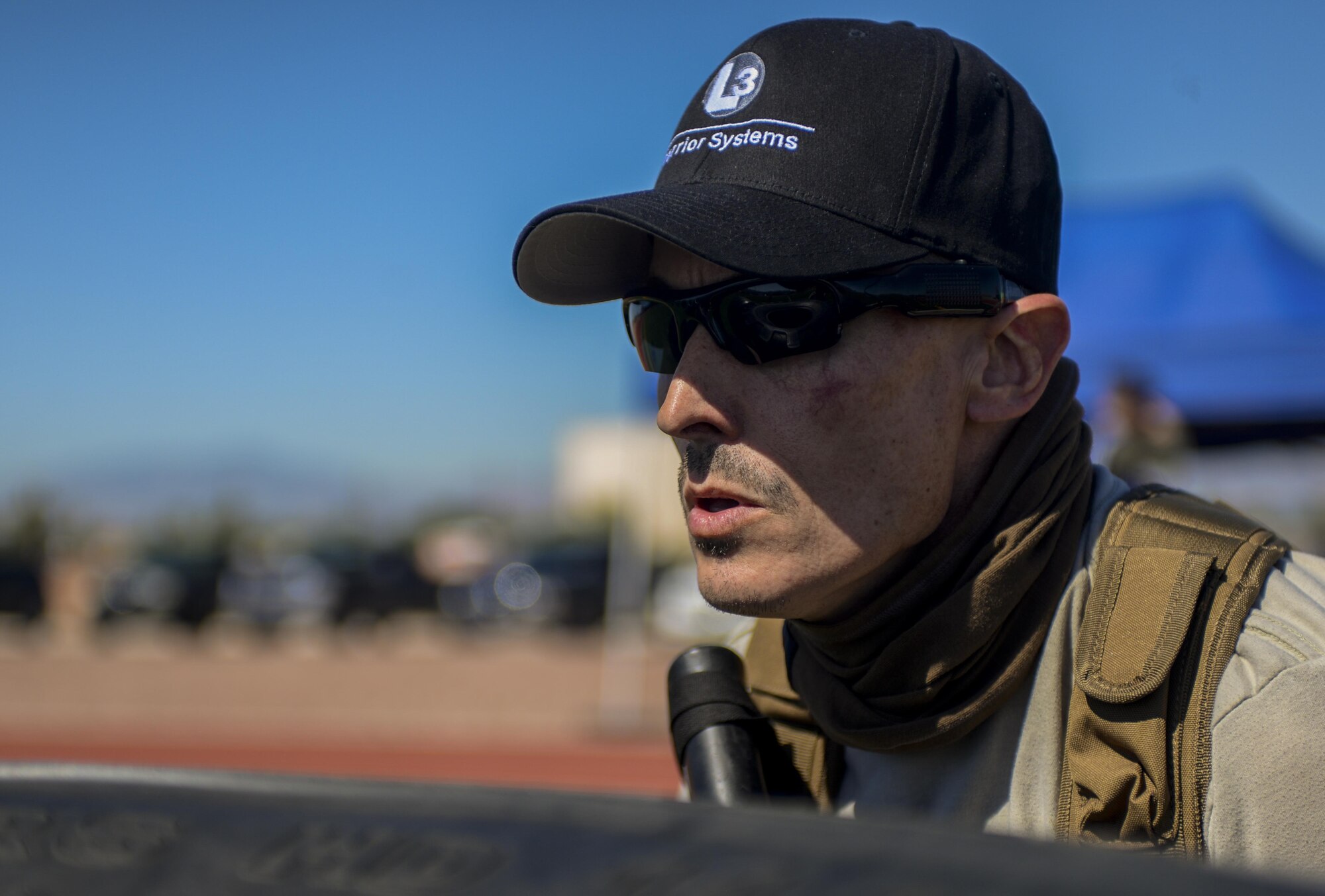 A simulated active shooter waits on the first responding 99th Security Forces Squadron Airmen during a base wide exercise at Nellis Air Force Base, Nev., May 12, 2016. On May 9-12, Nellis AFB conducted the exercise to evaluate real-life response capabilities of emergency personnel and the base populace to a variety of scenarios depicting situations that could impact the base at any time. (U.S. Air Force photo by Airman 1st Class Kevin Tanenbaum)