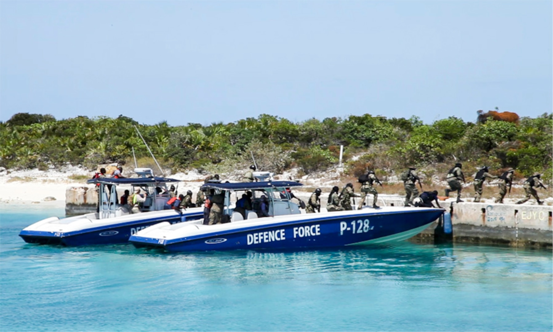 NASSAU, Bahamas (MAY 10, 2016) Members of the Royal Bahamas Defence Force exit a patrol boat during a simulated assault for Exercise Marlin Shield May 10, 2016.  Marlin Shield aims to promote interoperability between the RBDF, U.S. Northern Command and U.S. Special Operations Command North and allows both nations to practice combating terrorism and illicit trafficking in the Caribbean region. 