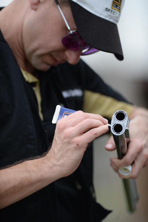 Army Skeet Team member Maj. Carl Wojtaszek, performs skeet competition shotgun maintenance on his gun during the 2016 Armed Services Skeet Championship. The competition was held May 9-13, 2016, at The Nashville Gun Club Tennessee Clay Target Complex near Nashville, Tennessee. DoD photo by Marvin D. Lynchard