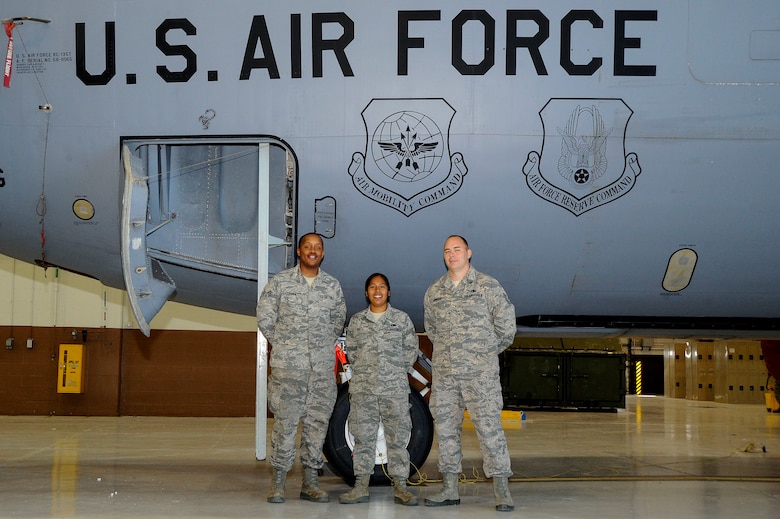 Tech. Sgt. Anthony Jordan, 22nd Aircraft Maintenance Squadron dedicated crew chief, right, Senior Airman Saemetruis Council 22nd AMXS assistant DCC, center, and Demetria Garcia 22nd AMXS ADCC, stand in front of the KC-135 Stratotanker they are assigned to, May 16, 2016, at McConnell Air Force Base, Kan. The DCC program matches a team of Airmen up with an aircraft and they become the responsible oversight for any maintenance issues that arise. (U.S. Air Force photo/Airman 1st Class Jenna K. Caldwell)